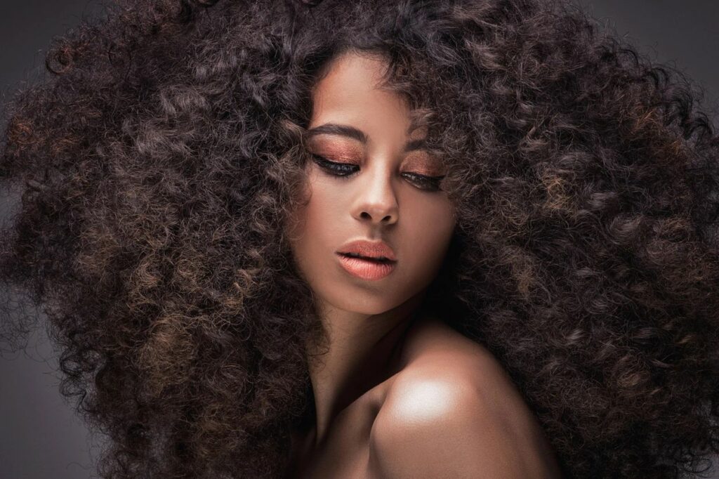 Cosmetology School In Maryland woman with curly hair