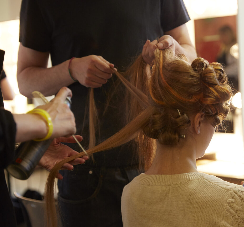 Aveda Institute Maryland Hair School woman in salon receiving hair texturing