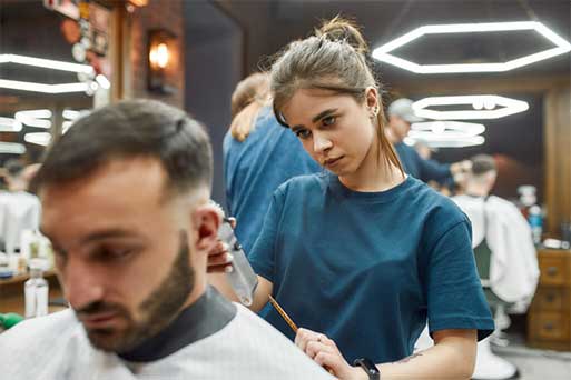 barber stylist in Maryland giving haircut with clippers